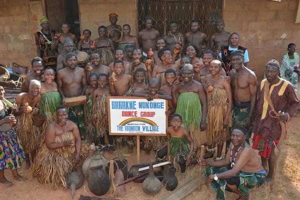 The Barakwe Mukonge Dance Group posed behind its painted sign