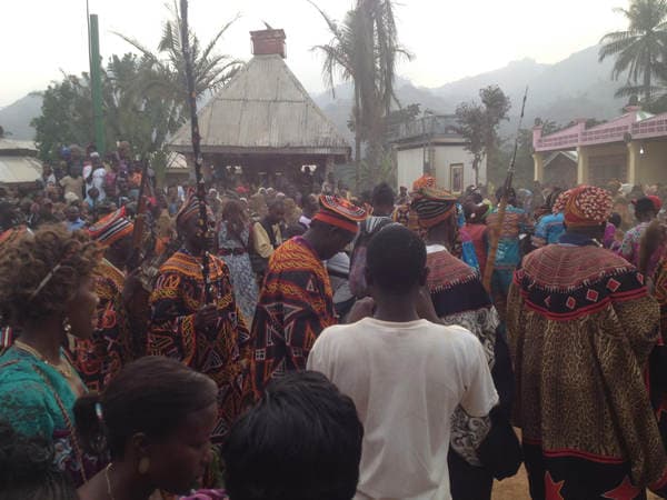 Sons and daughters of Guneku assembled on the palace grounds of the village on 27 February 2015 for the return of HRH Fomuki in younger and energetic clothing. — photograph from the Guneku Fondom archive