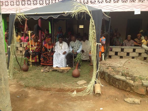 Sons and daughters of Guneku assembled on the palace grounds of the village on 27 February 2015 for the return of HRH Fomuki in younger and energetic clothing. — photograph from the Guneku Fondom archive