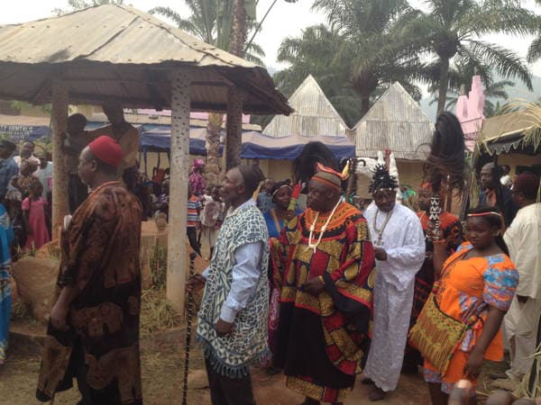 Sons and daughters of Guneku assembled on the palace grounds of the village on 27 February 2015 for the return of HRH Fomuki in younger and energetic clothing. — photograph from the Guneku Fondom archive