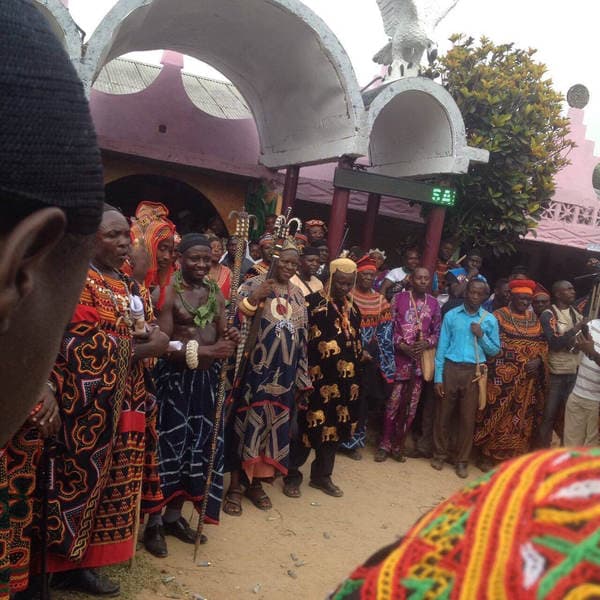 Sons and daughters of Guneku assembled on the palace grounds of the village on 27 February 2015 for the return of HRH Fomuki in younger and energetic clothing. — photograph from the Guneku Fondom archive