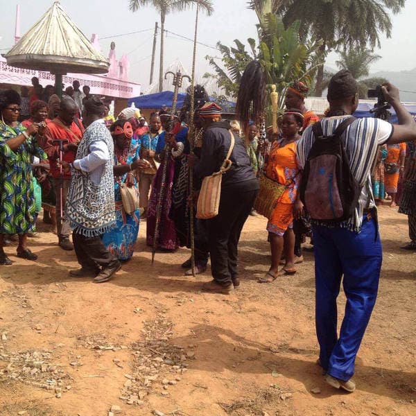 Sons and daughters of Guneku assembled on the palace grounds of the village on 27 February 2015 for the return of HRH Fomuki in younger and energetic clothing. — photograph from the Guneku Fondom archive