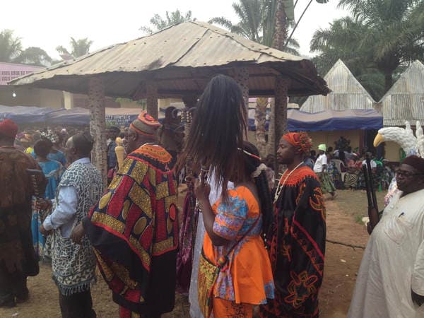Sons and daughters of Guneku assembled on the palace grounds of the village on 27 February 2015 for the return of HRH Fomuki in younger and energetic clothing. — photograph from the Guneku Fondom archive