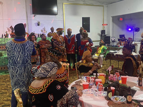 Guests in Meta regalia gathered in the hall at the GUDECA-US welcome event.